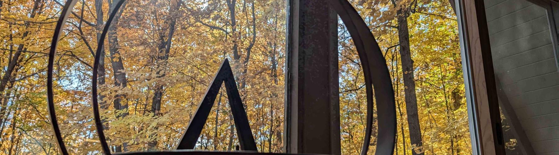 The Lake Fellowship chalice with a background of autumn leaves