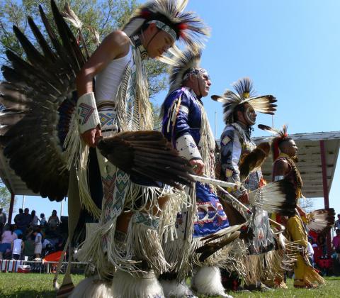 Four Ho-Chunk dancers at a Pow-Wow