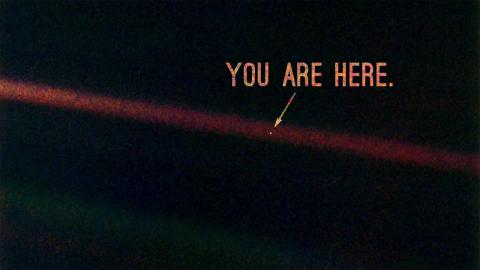 photo taken from outer space showing the "pale blue dot" of earth