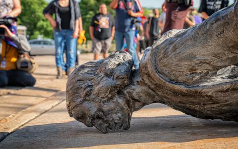 photo of the statute of Columbus on the ground, that was toppled in June 2020, MN by activists