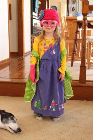 photo of child wearing many mismatched and colorful clothes