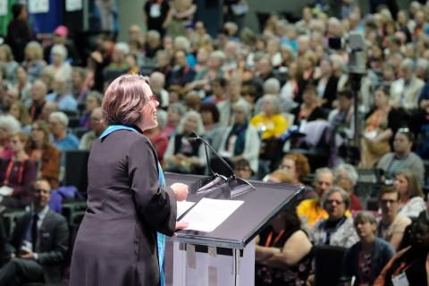 Photo of outgoing UUA president, Susan Frederick-Gray speaking to a crowd at the UUA General Assembly