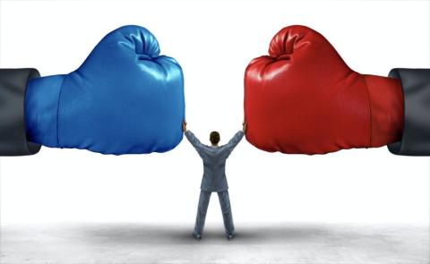 graphic of a person halting the collision of two giant boxing gloves, one blue and one red