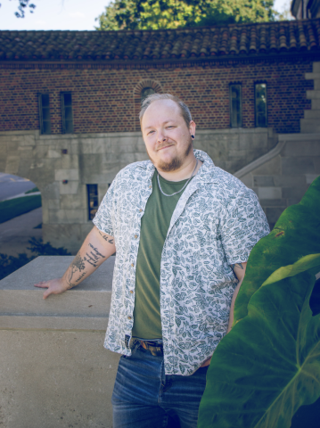 Seth Anderson-Matz standing outside near a brick building